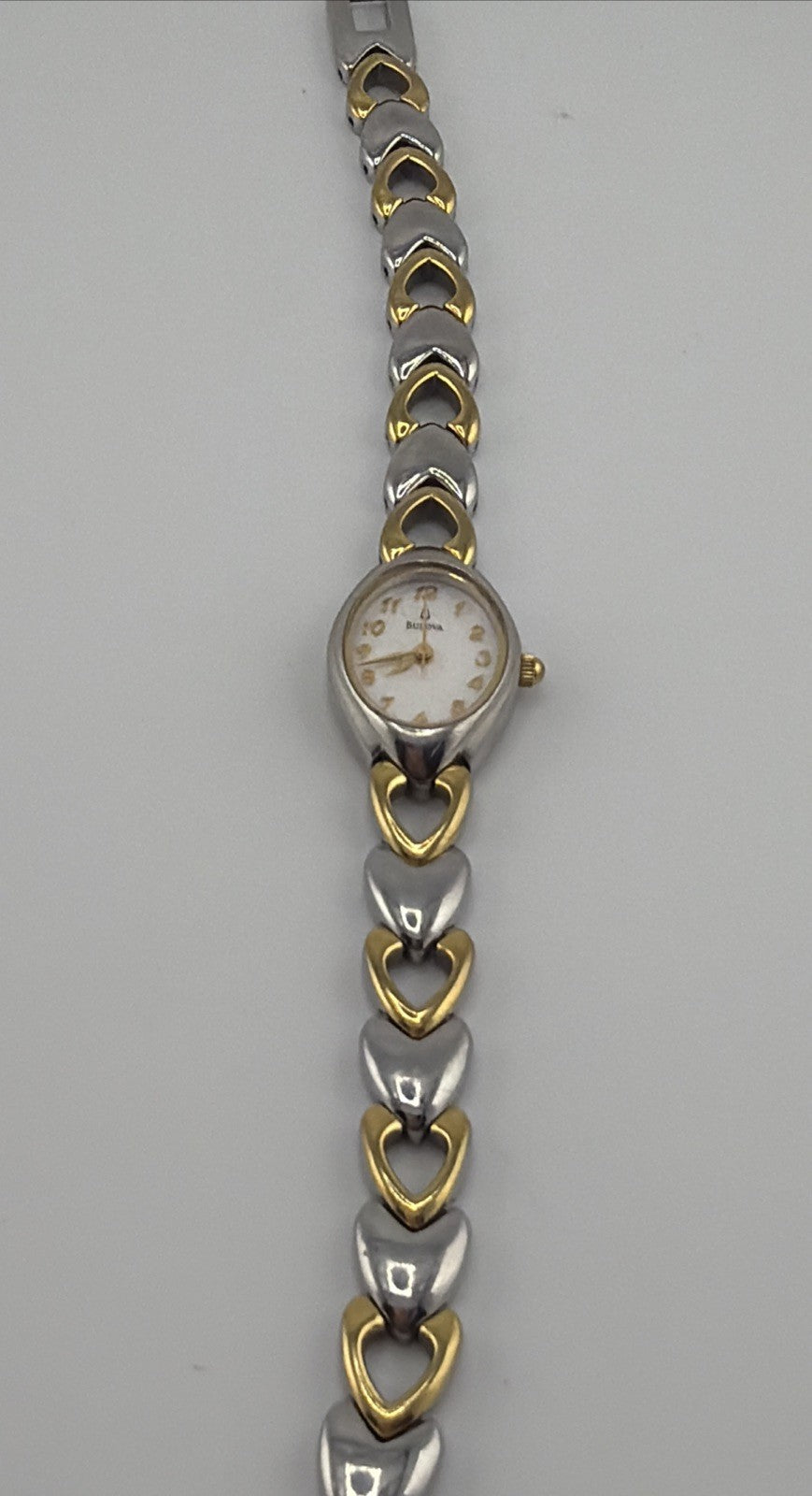 Bulova Womens Two Tone Heart Link Bracelet Quartz Watch Oval Dial