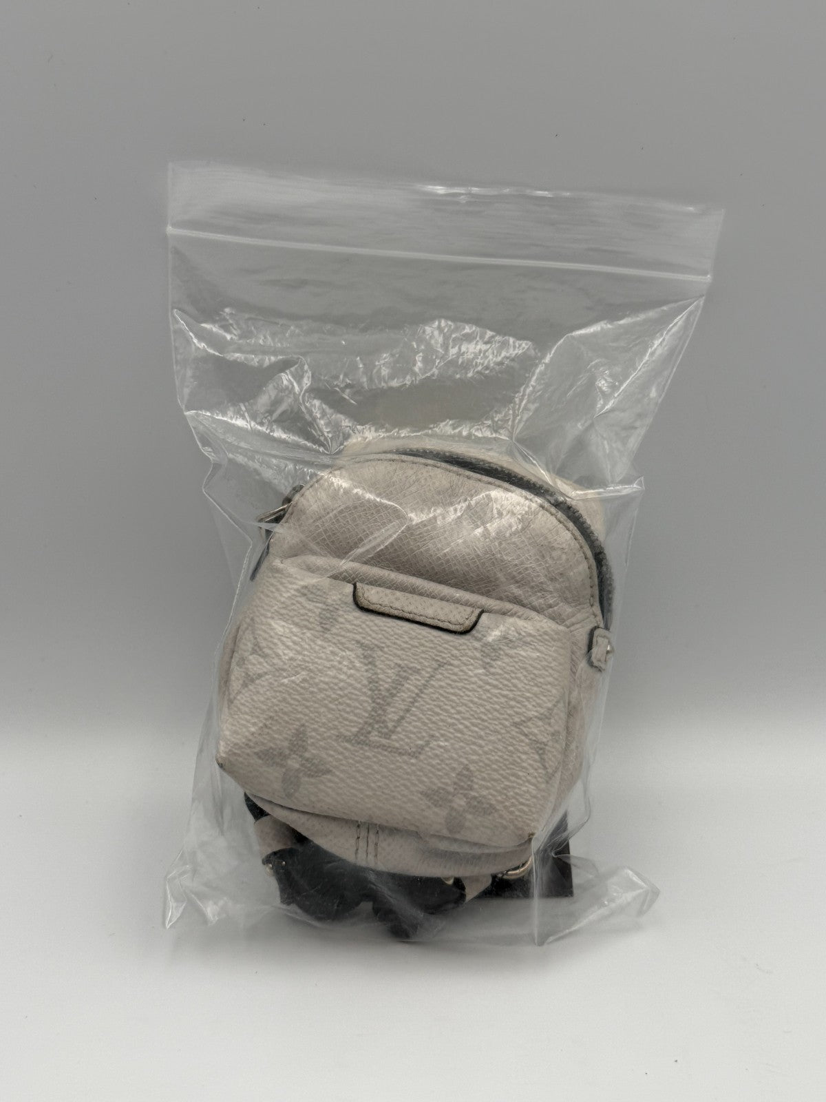 Louis Vuitton Taigarama Discovery Backpack Bag Charm White Key Holder M69318
